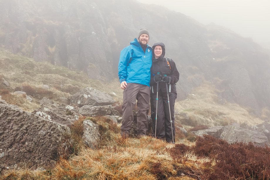 hikers standing mist on mountainside