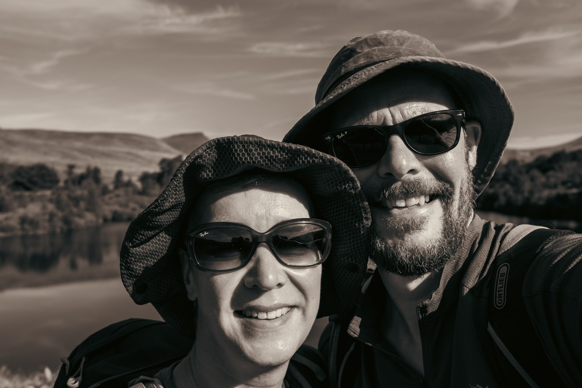 black and white selfie shot of 2 hikers