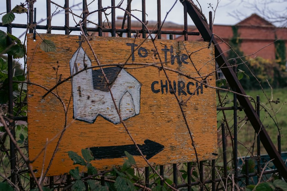 hand painted sign with drawing of church