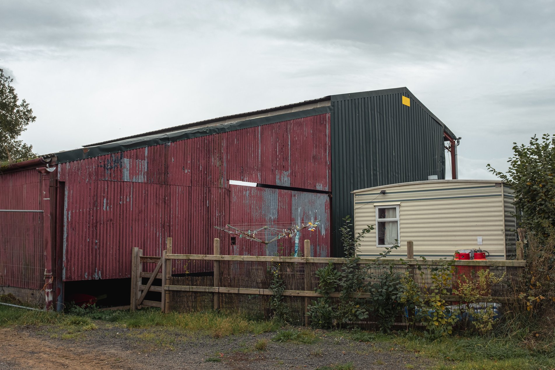 red barn and white caravan