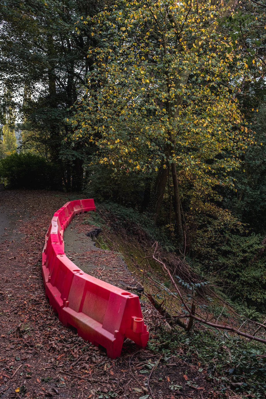 red barrier around road subsidence