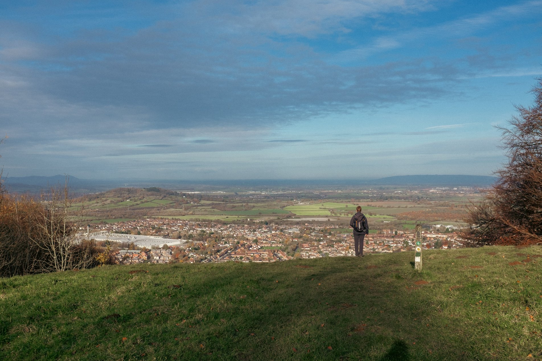figure on hill looking at view