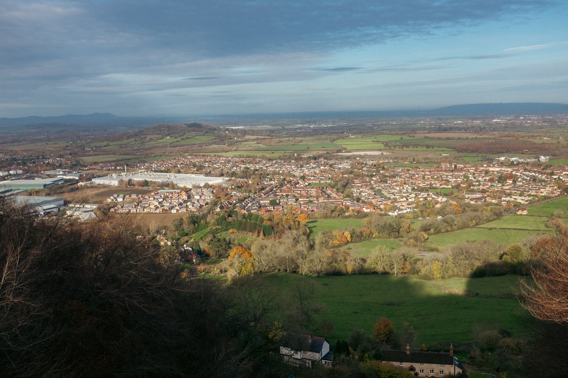 landscape view with houses and light industry in foreground