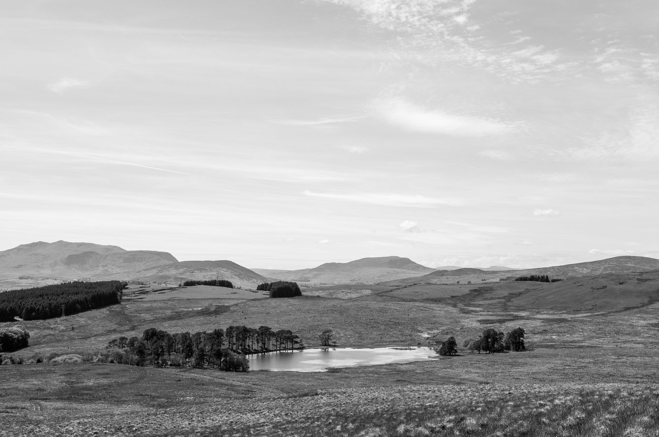 black and white mountain landscape with lake