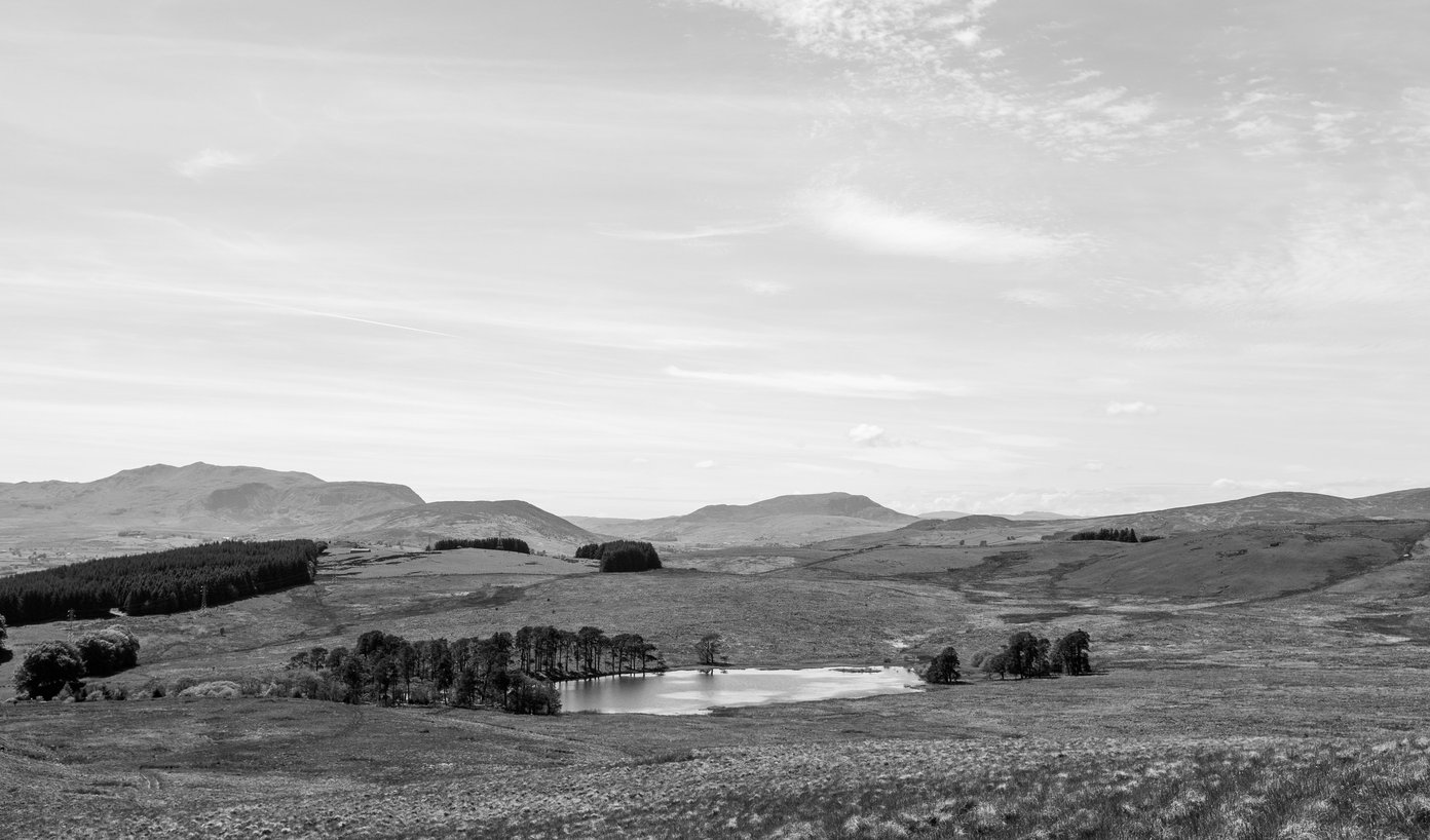 black and white mountain landscape with lake