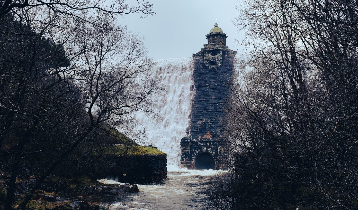 dam overflowing with water