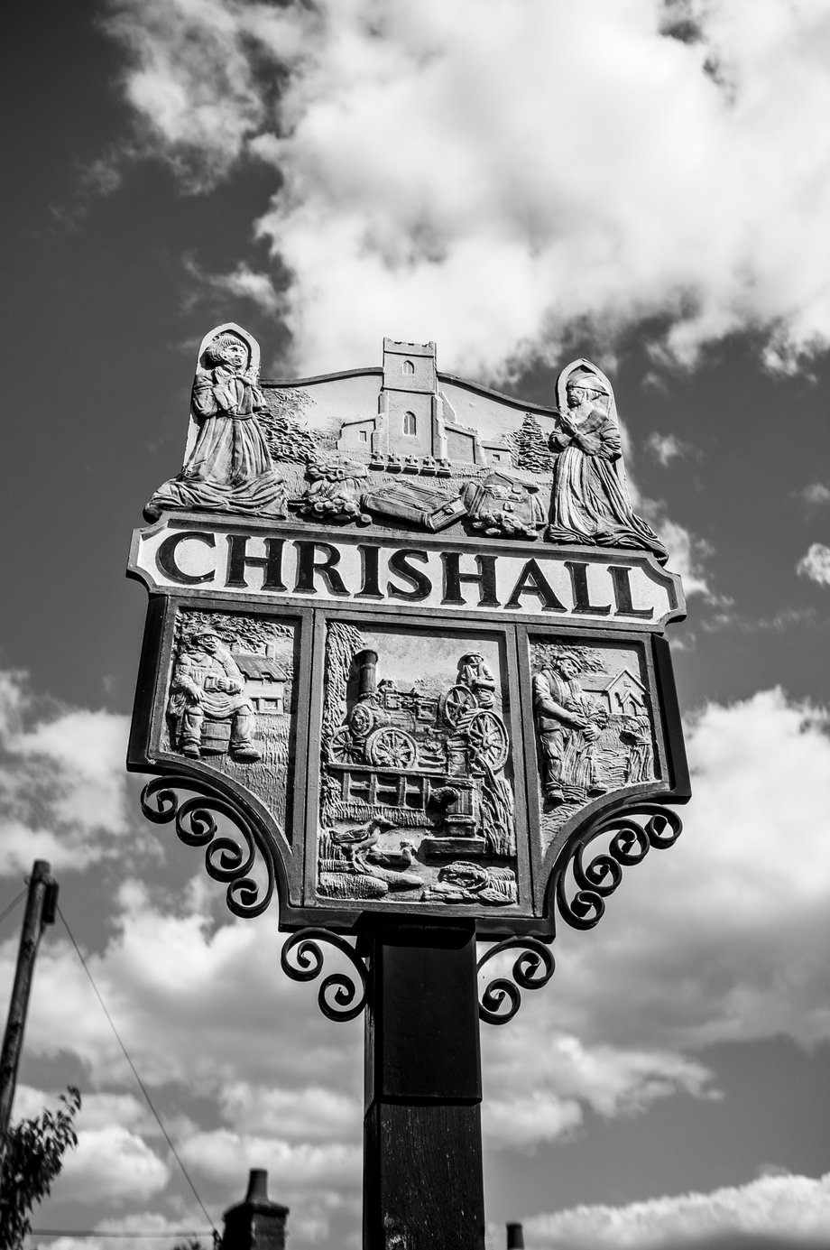 village sign showing the chrishall coat of arms