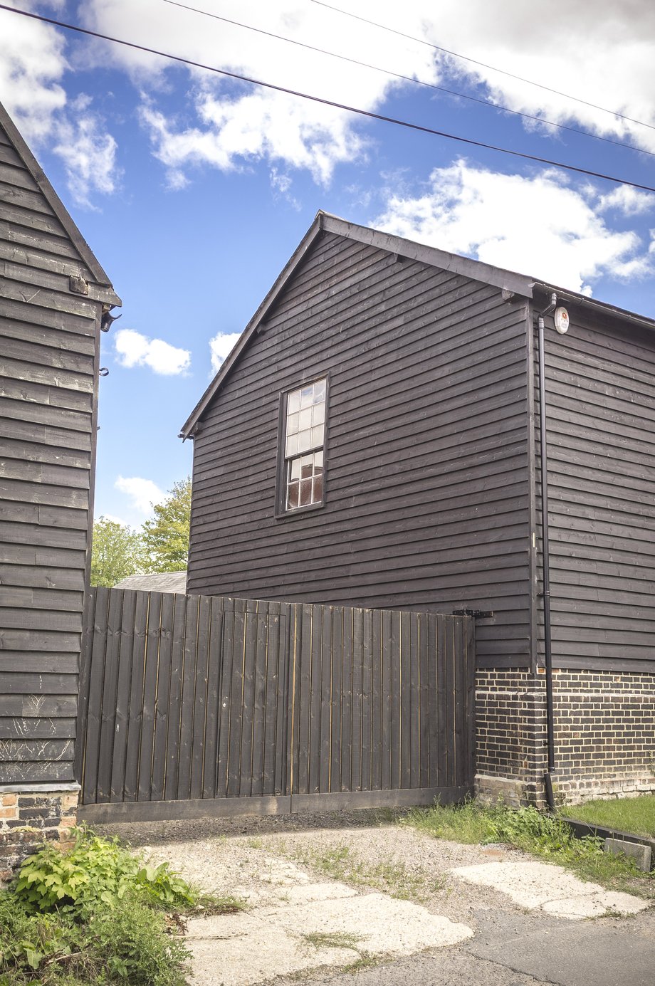 black wooden clad buildings