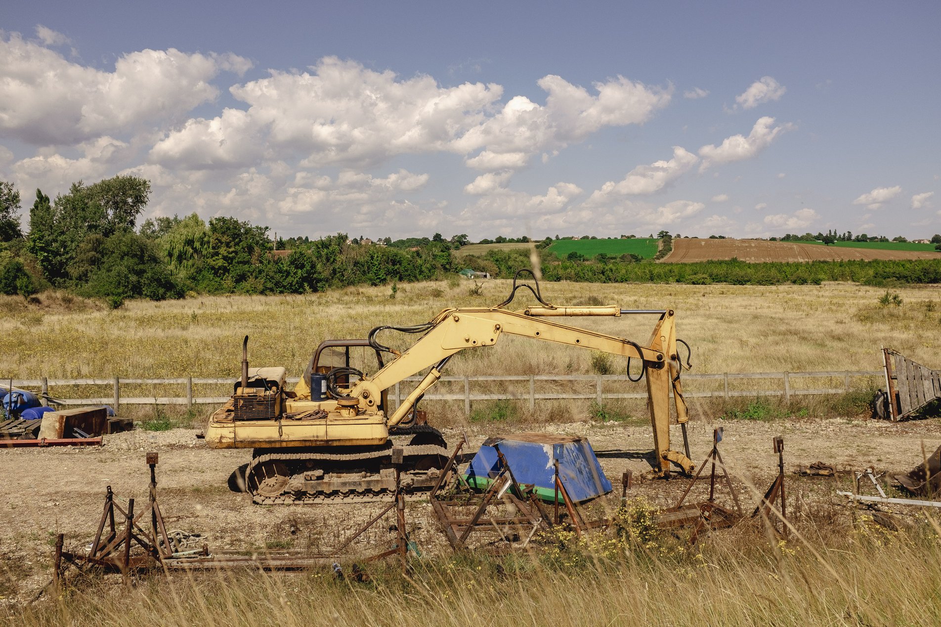 yellow digger in field