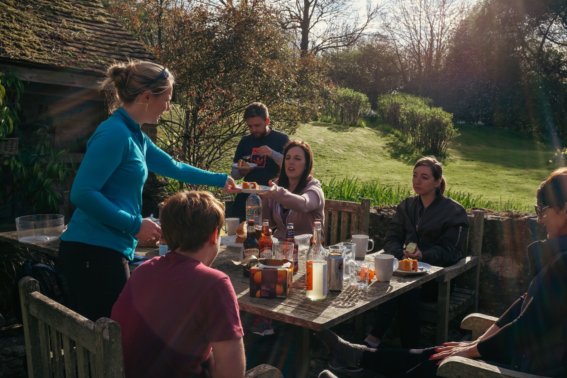 group eating outside in early evening
