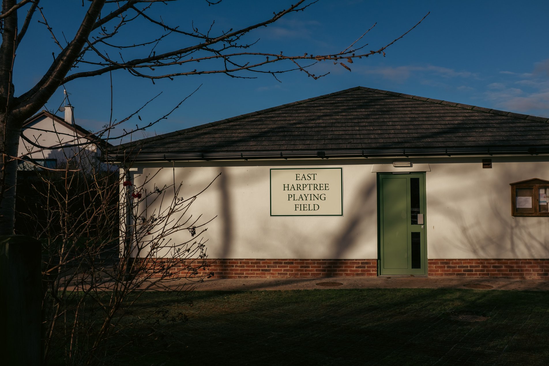 pavillion building with sign reading 'east harptree playing field'
