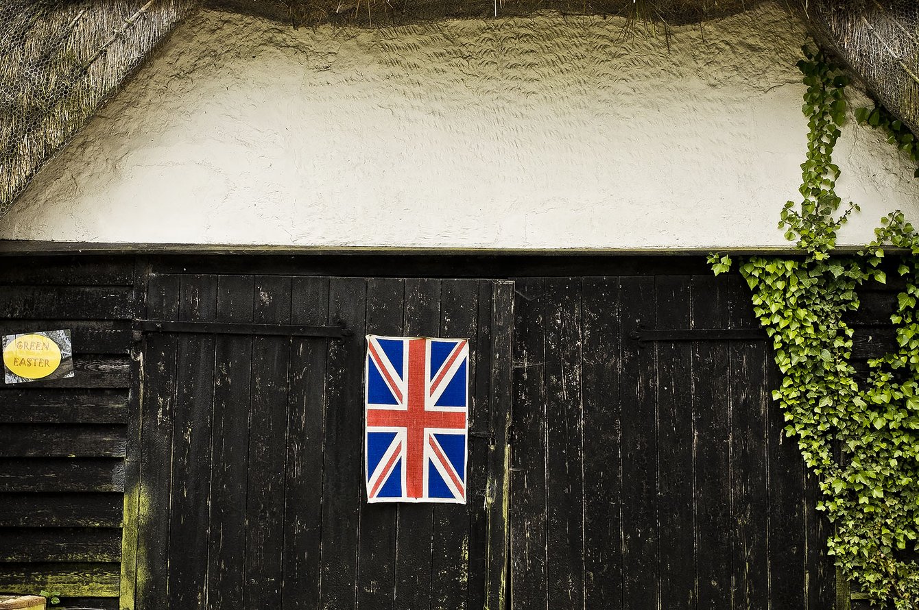 barn with union flag on door
