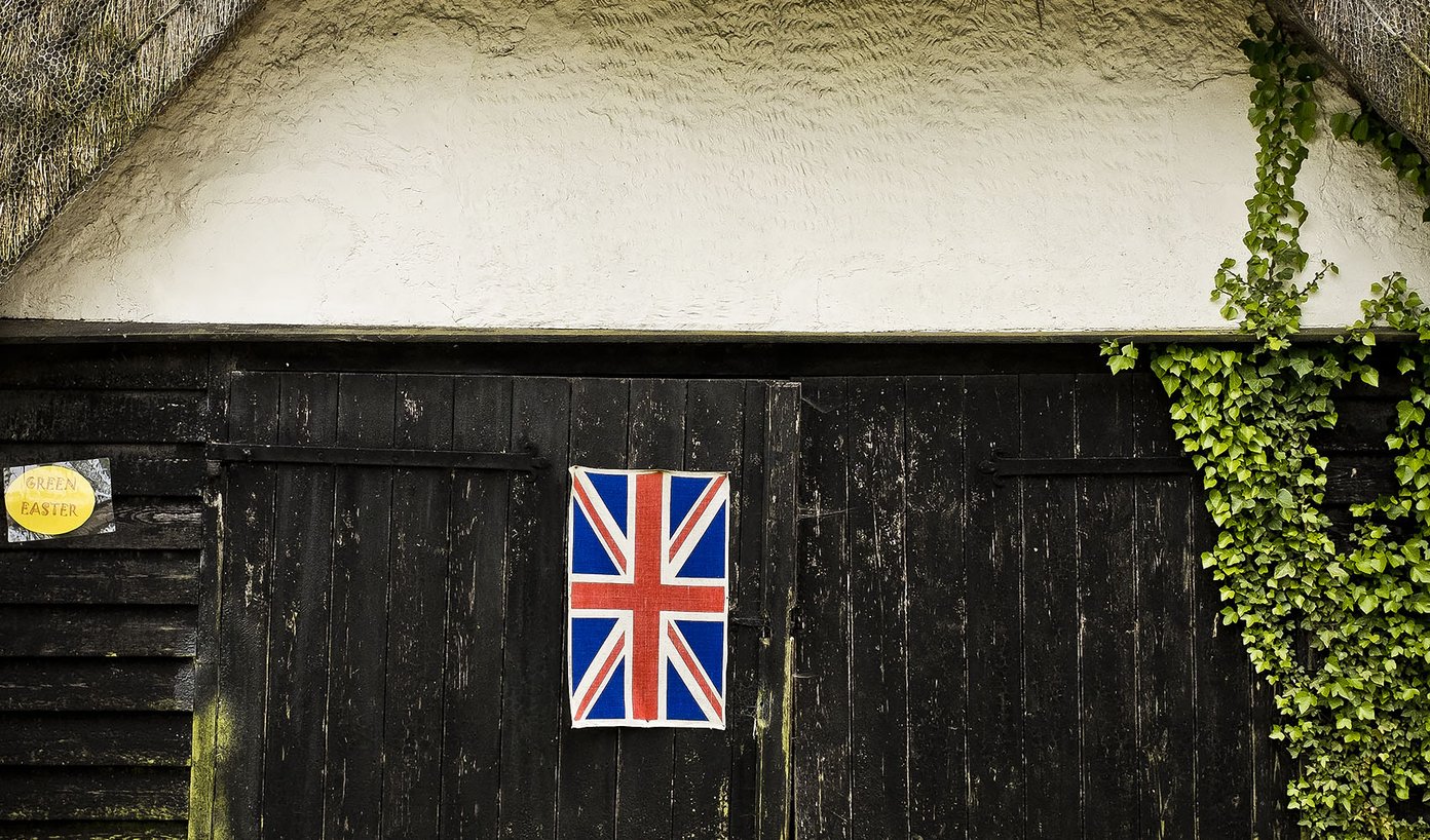 barn with union flag on door