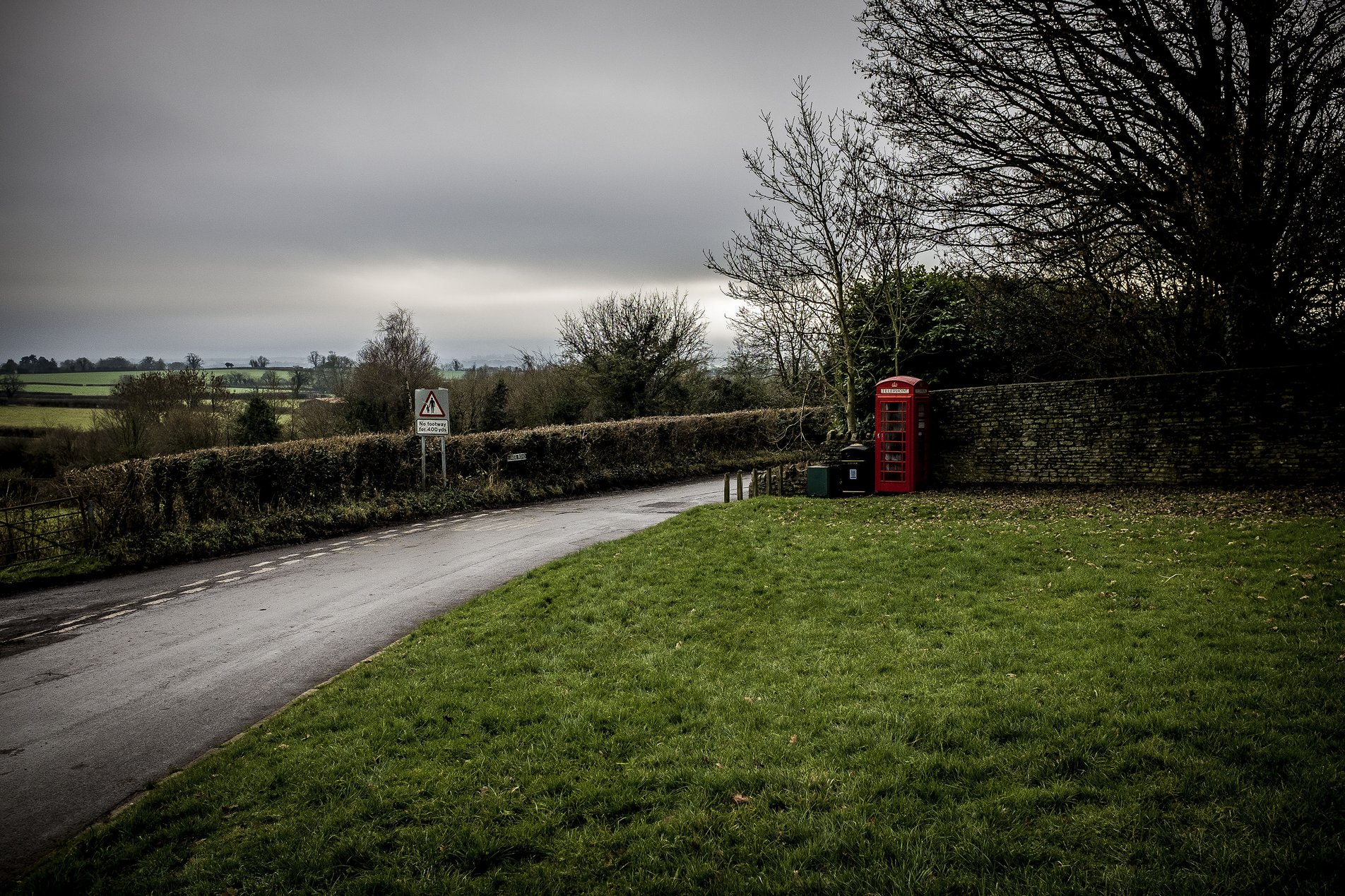 rural village green with red phone box