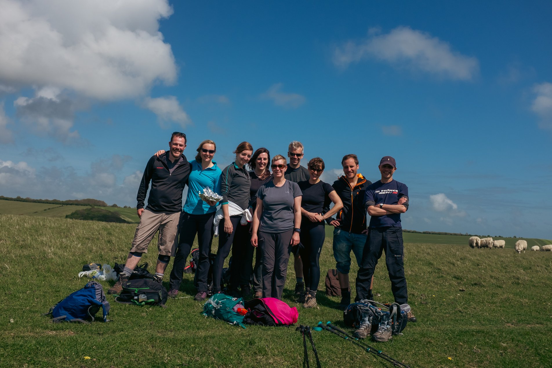 team shot of group of hikers on hill