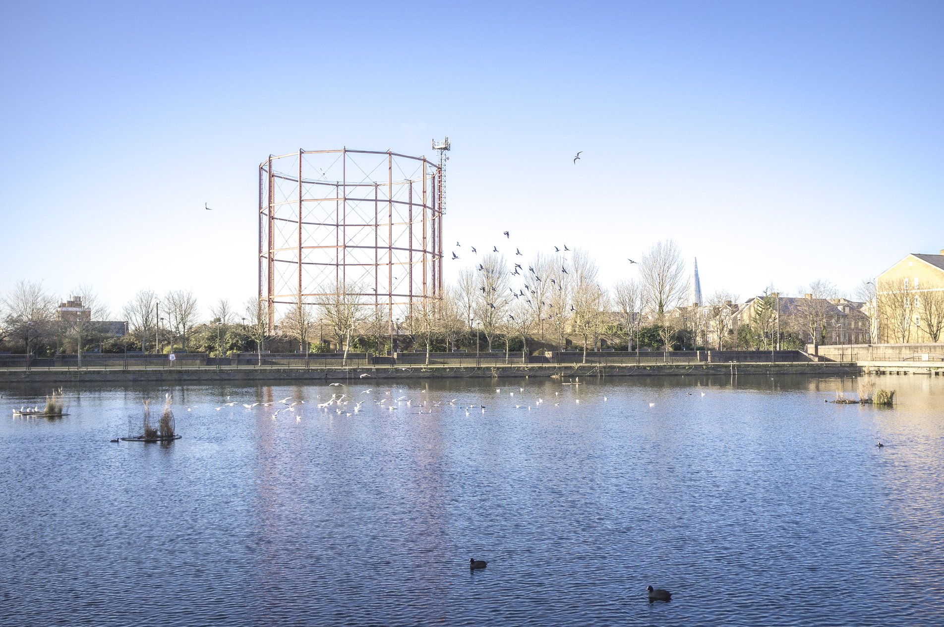 urban lake with empty gasometer