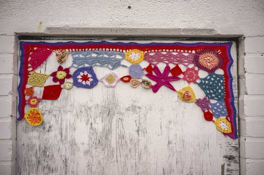 yarn bombing on old doorway