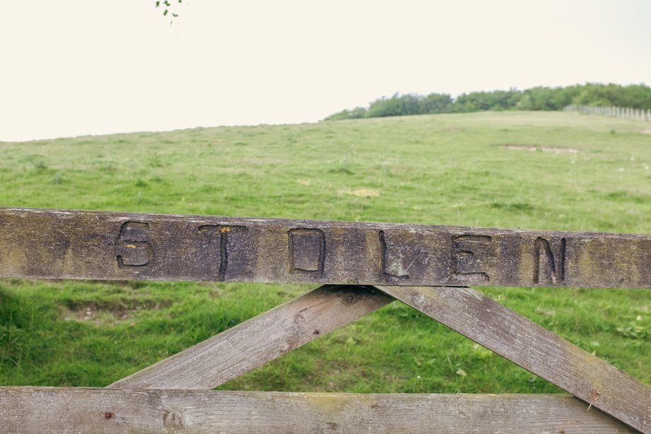 gate with the word 'stolen' engraved on it