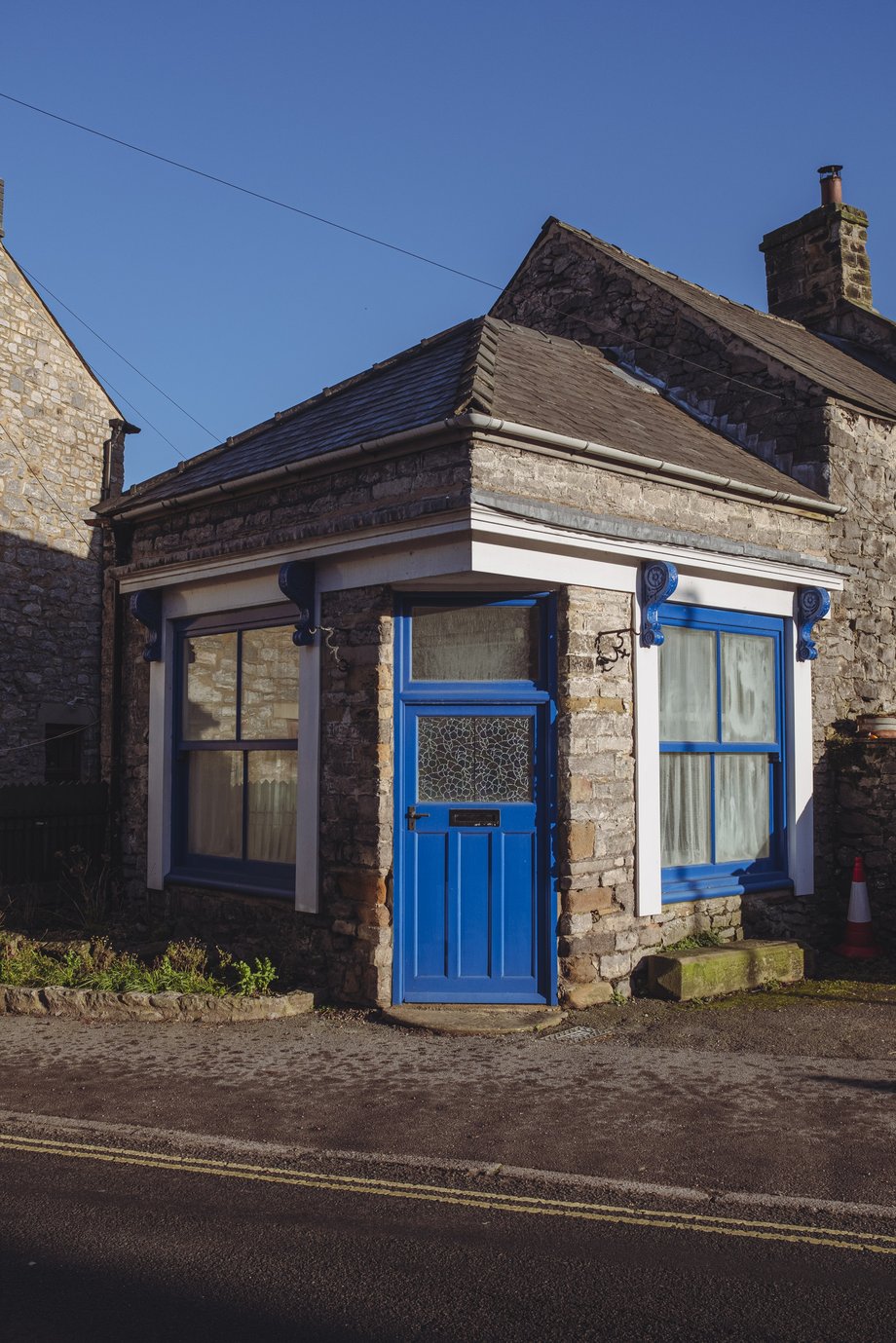 blue door on stone house