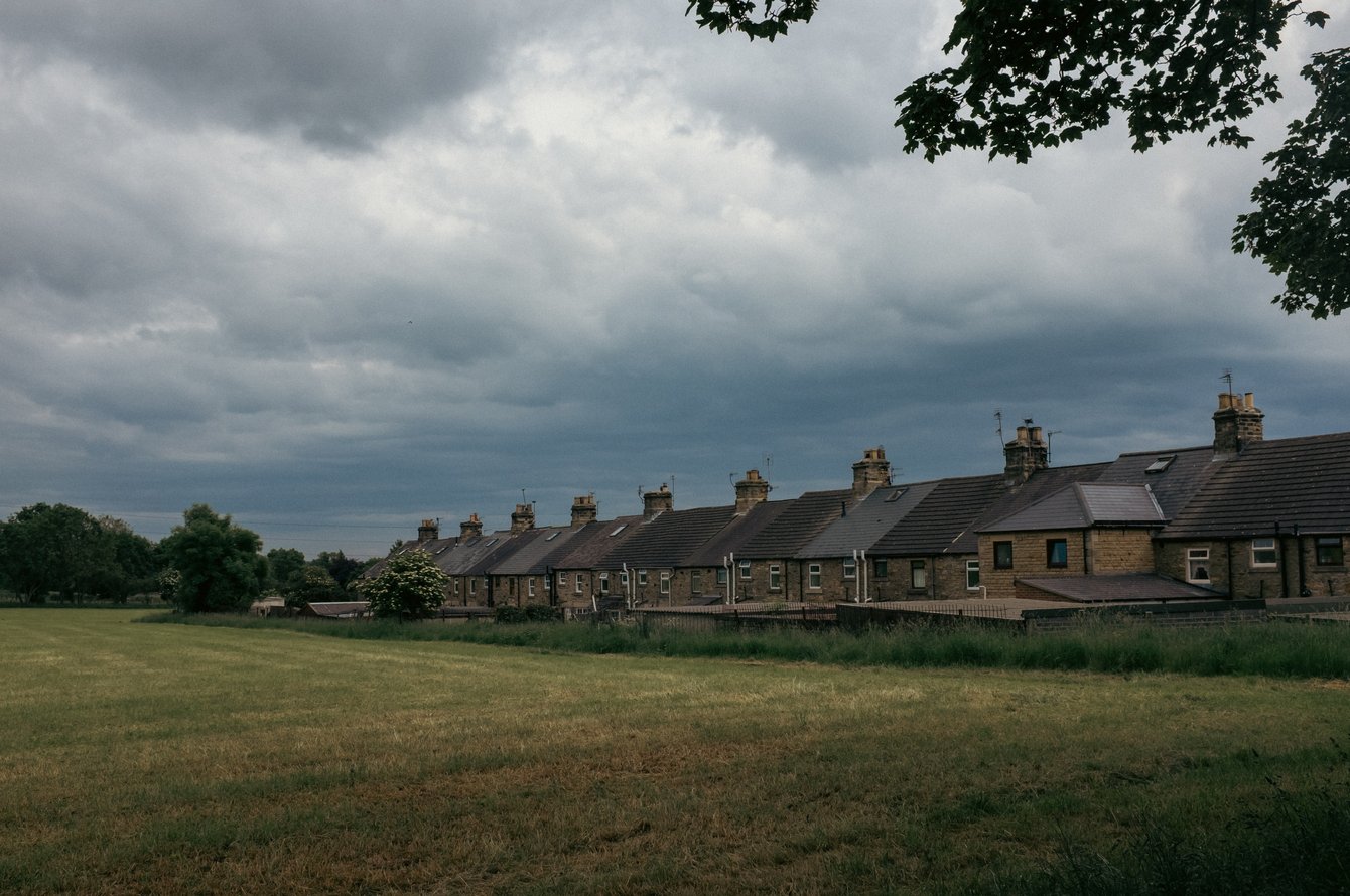 terraced cottages alongside field