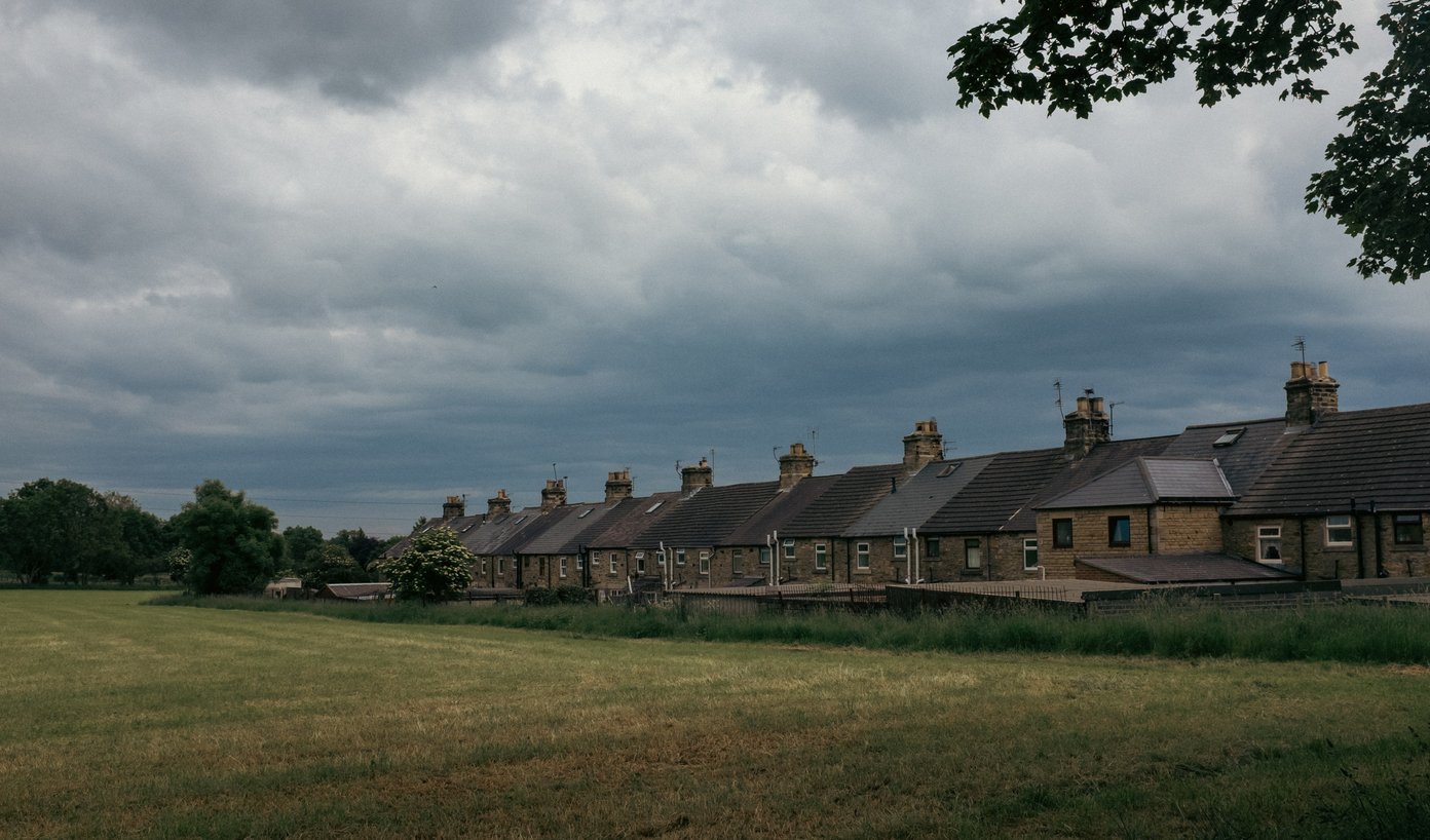 terraced cottages alongside field